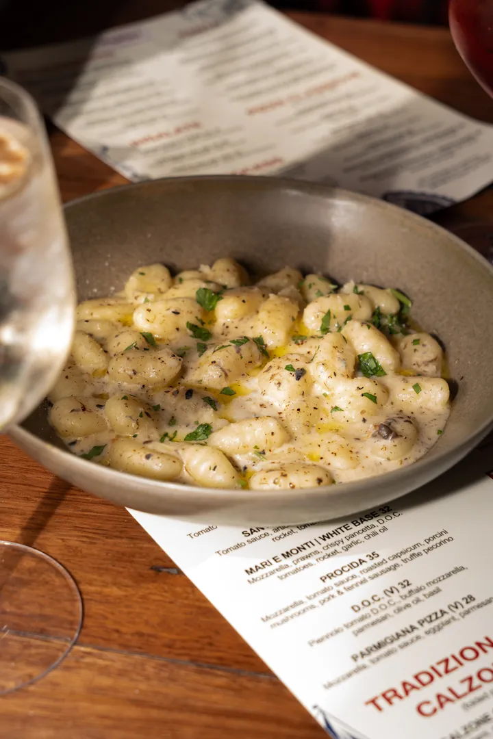 A bowl of gnocchi on the table