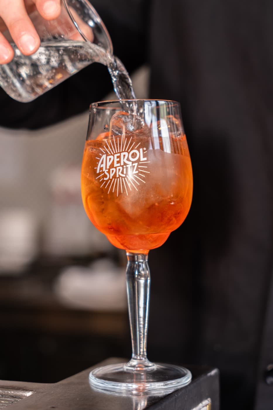 An orange spritz on a sunny table